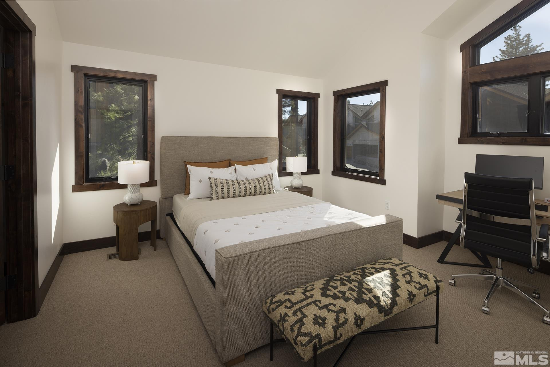 146 Sierra Colina Drive, Unit 34 Stateline, NV 89449 - Photo 23 of 38 a bedroom with a bed a couch and dresser