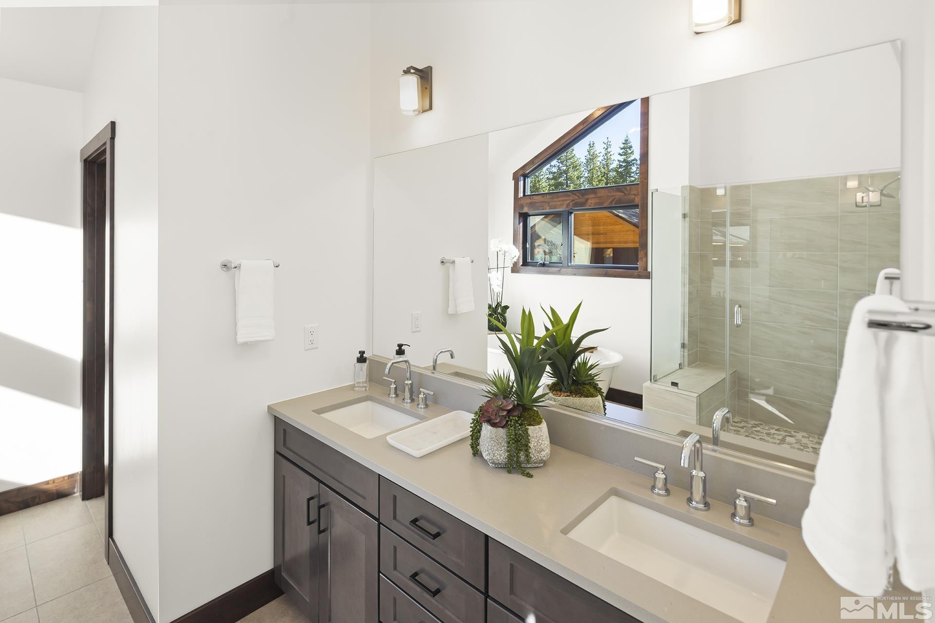 146 Sierra Colina Drive, Unit 34 Stateline, NV 89449 - Photo 26 of 38 a bathroom with a sink a vanity and mirror