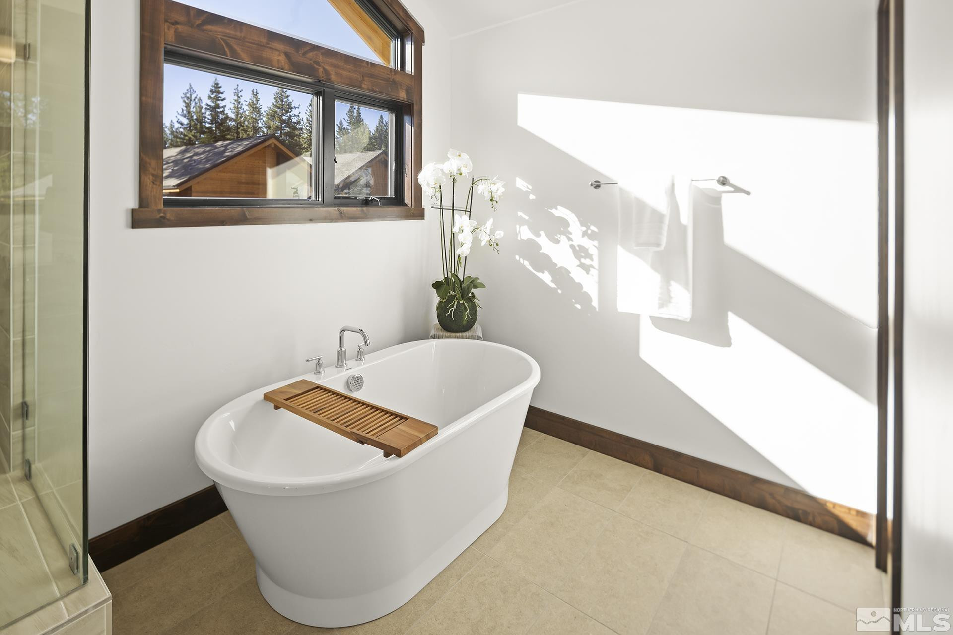 146 Sierra Colina Drive, Unit 34 Stateline, NV 89449 - Photo 27 of 38 a white bath tub sitting next to a window