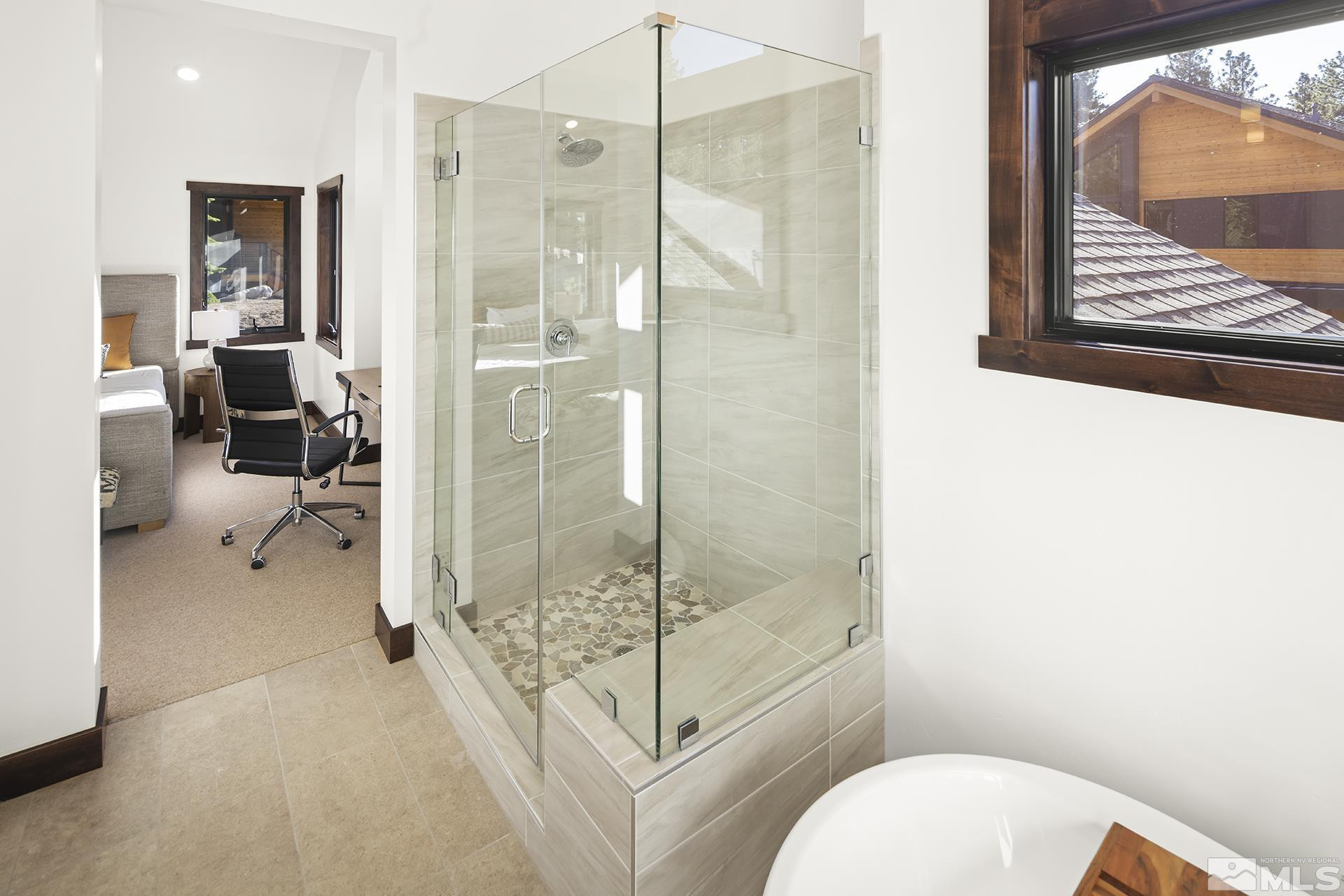 146 Sierra Colina Drive, Unit 34 Stateline, NV 89449 - Photo 28 of 38 a bathroom with a toilet and a shower