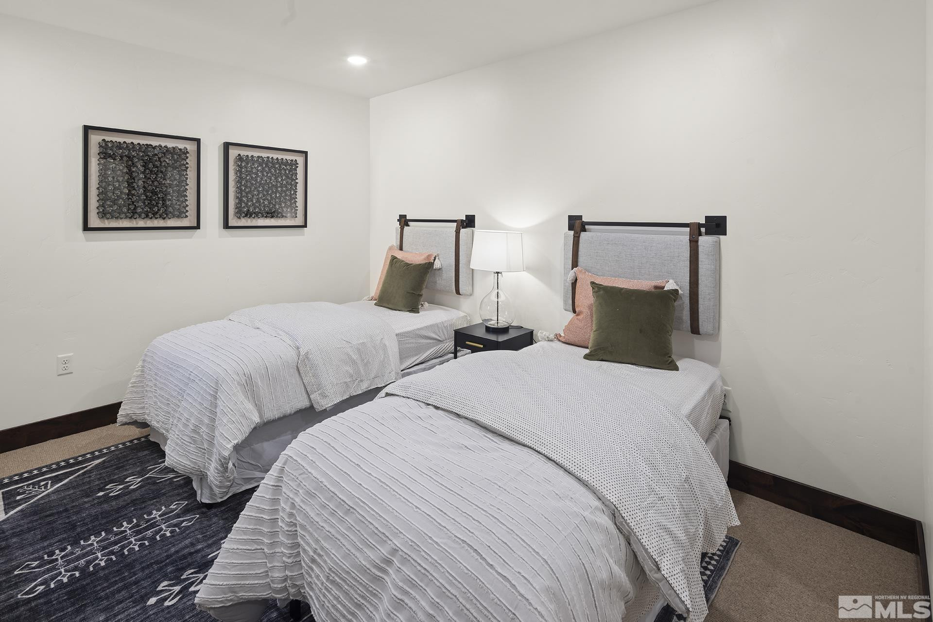 146 Sierra Colina Drive, Unit 34 Stateline, NV 89449 - Photo 29 of 38 a bedroom with two beds and painting on the wall