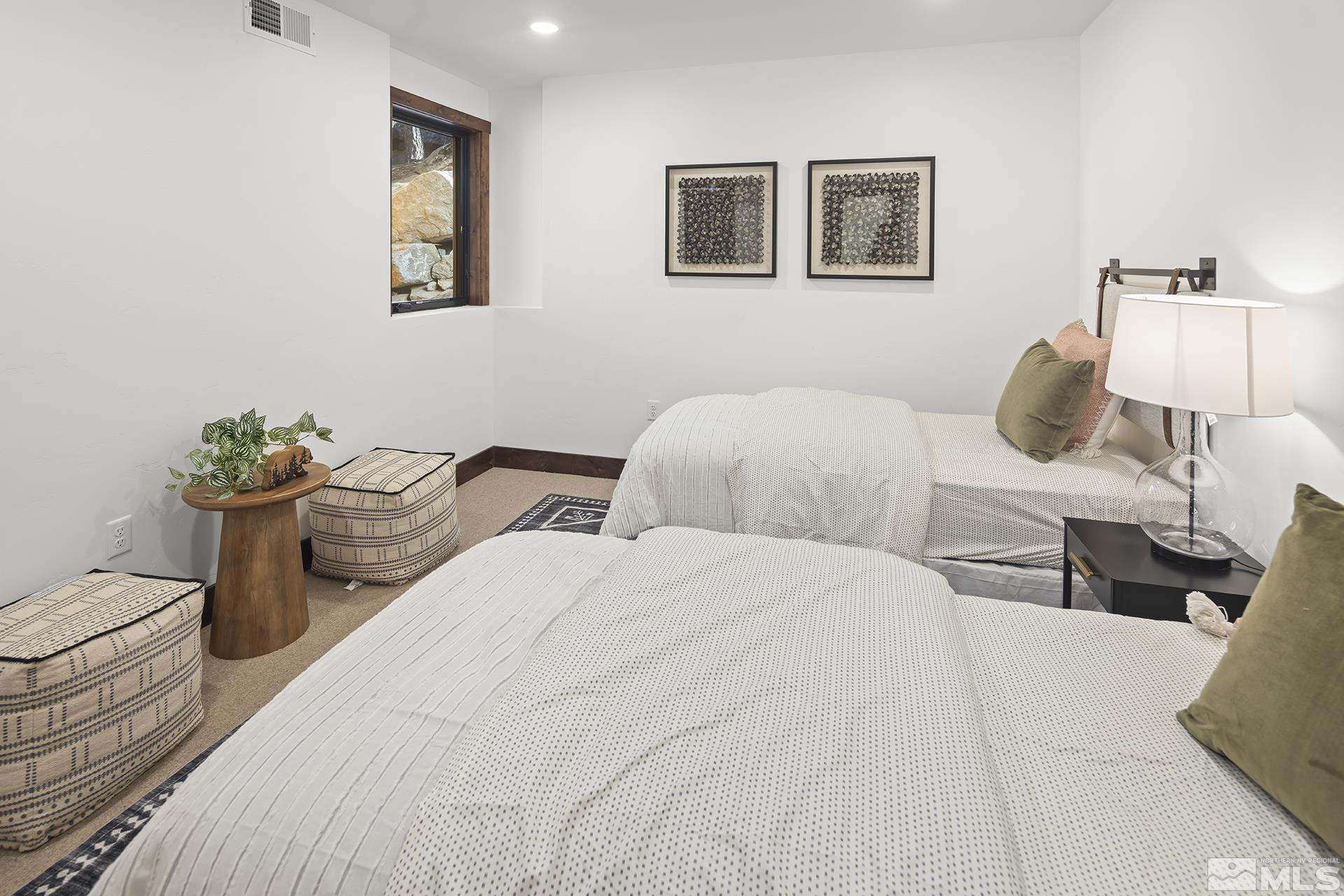 146 Sierra Colina Drive, Unit 34 Stateline, NV 89449 - Photo 30 of 38 a bedroom with two beds and a table