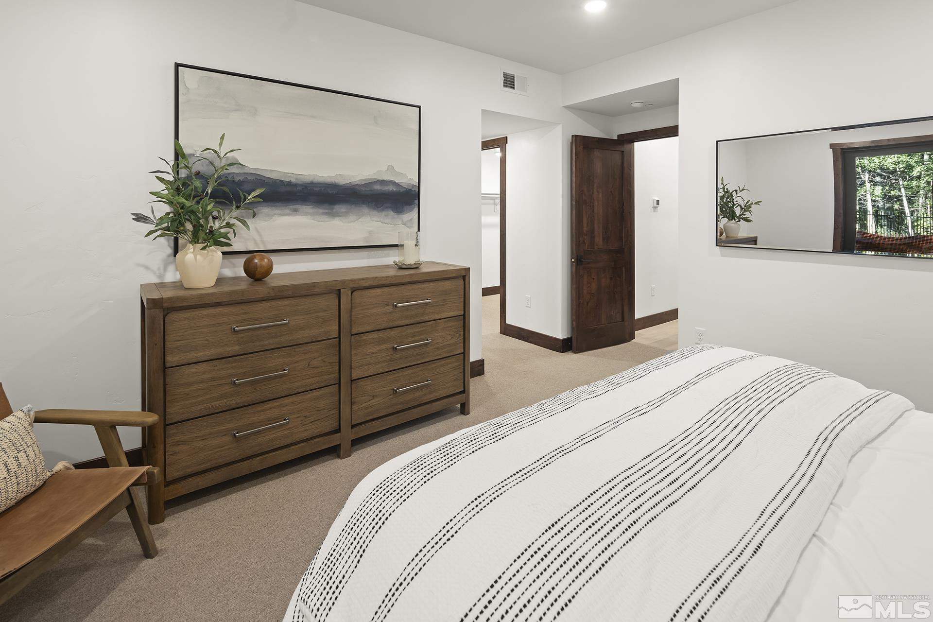 146 Sierra Colina Drive, Unit 34 Stateline, NV 89449 - Photo 34 of 38 a bedroom with a bed and a flat screen tv