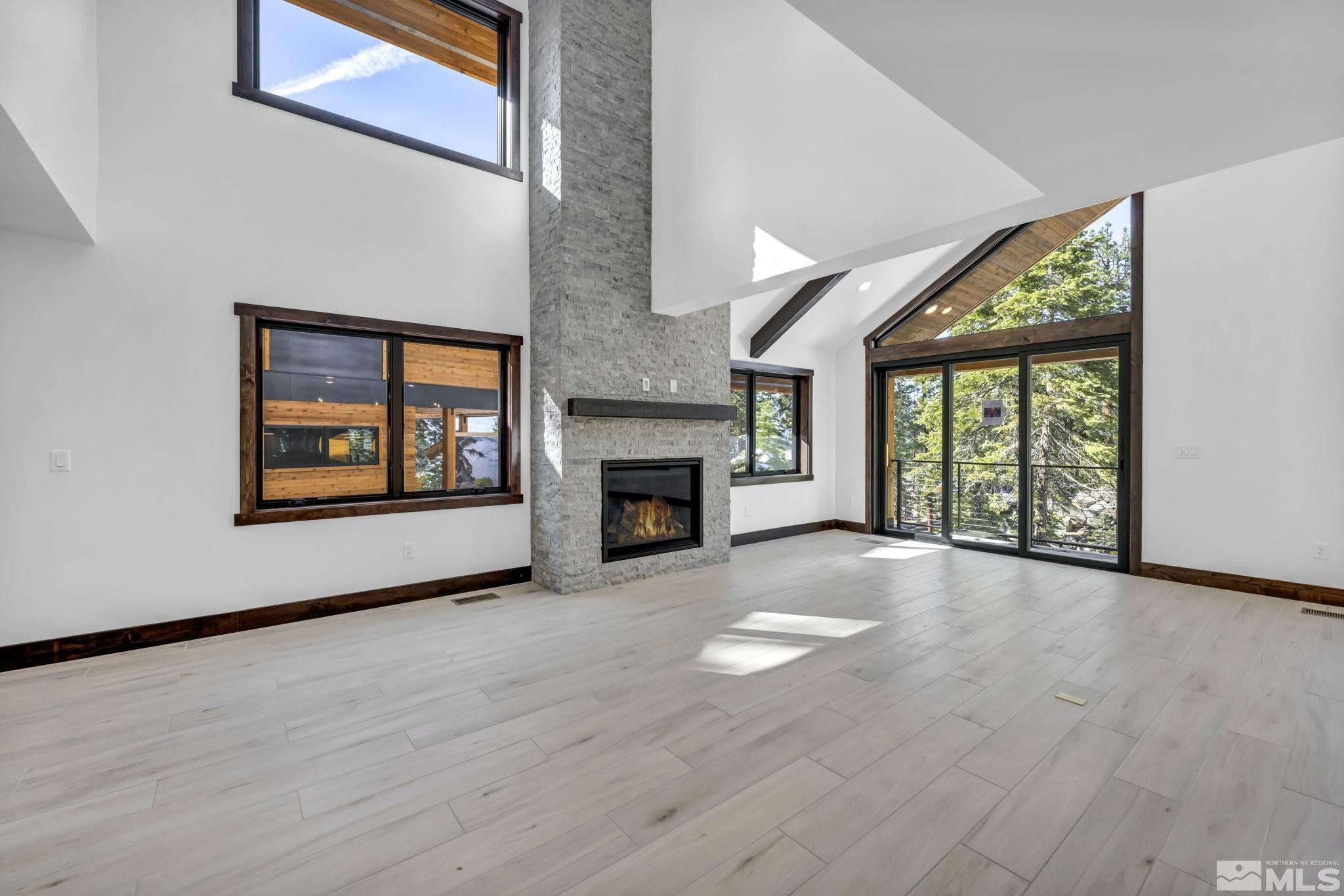 146 Sierra Colina Drive, Unit 34 Stateline, NV 89449 - Photo 4 of 38 a view of an empty room with a window and fireplace