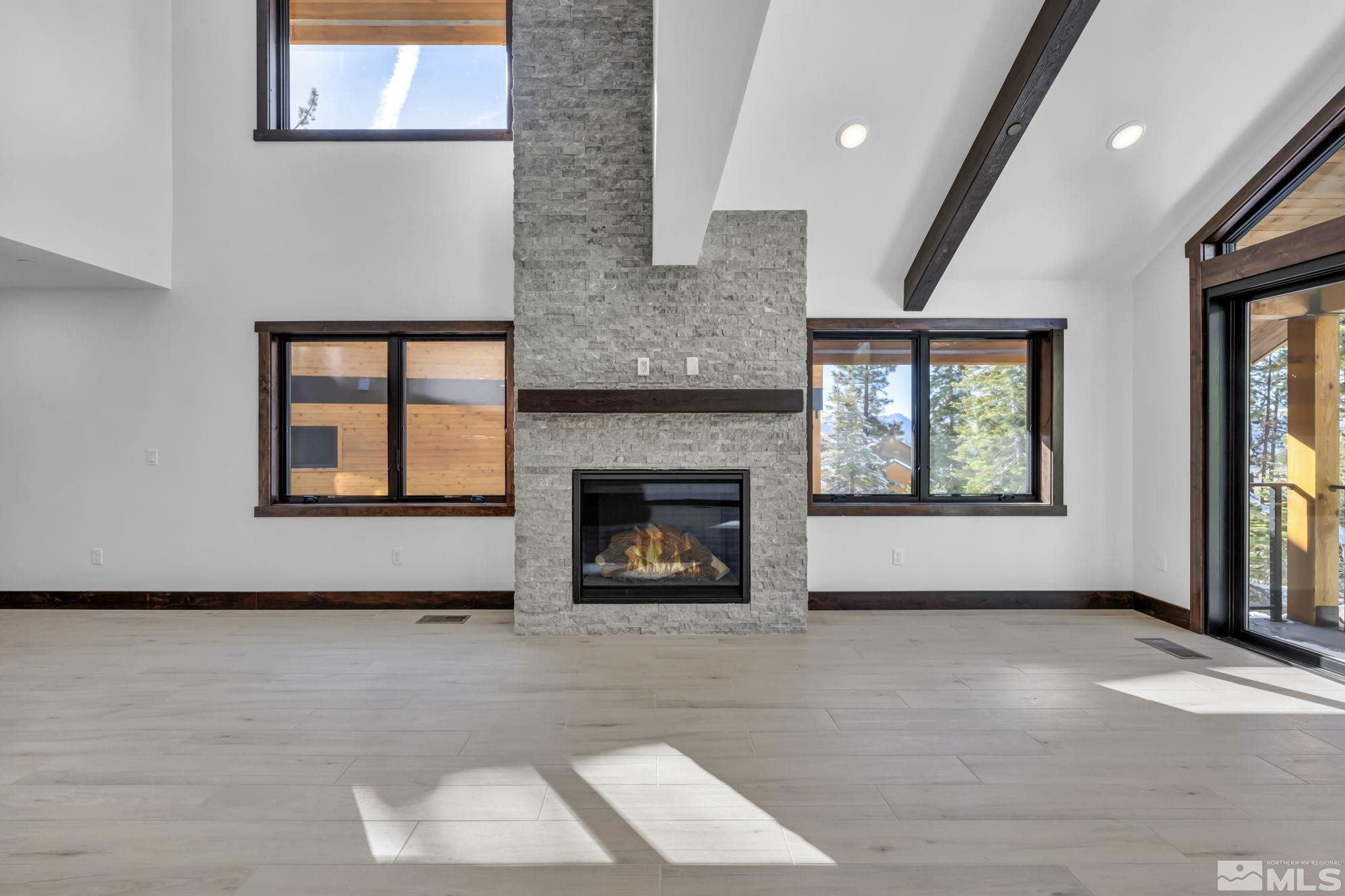 146 Sierra Colina Drive, Unit 34 Stateline, NV 89449 - Photo 5 of 38 a view of an empty room with a window and fireplace