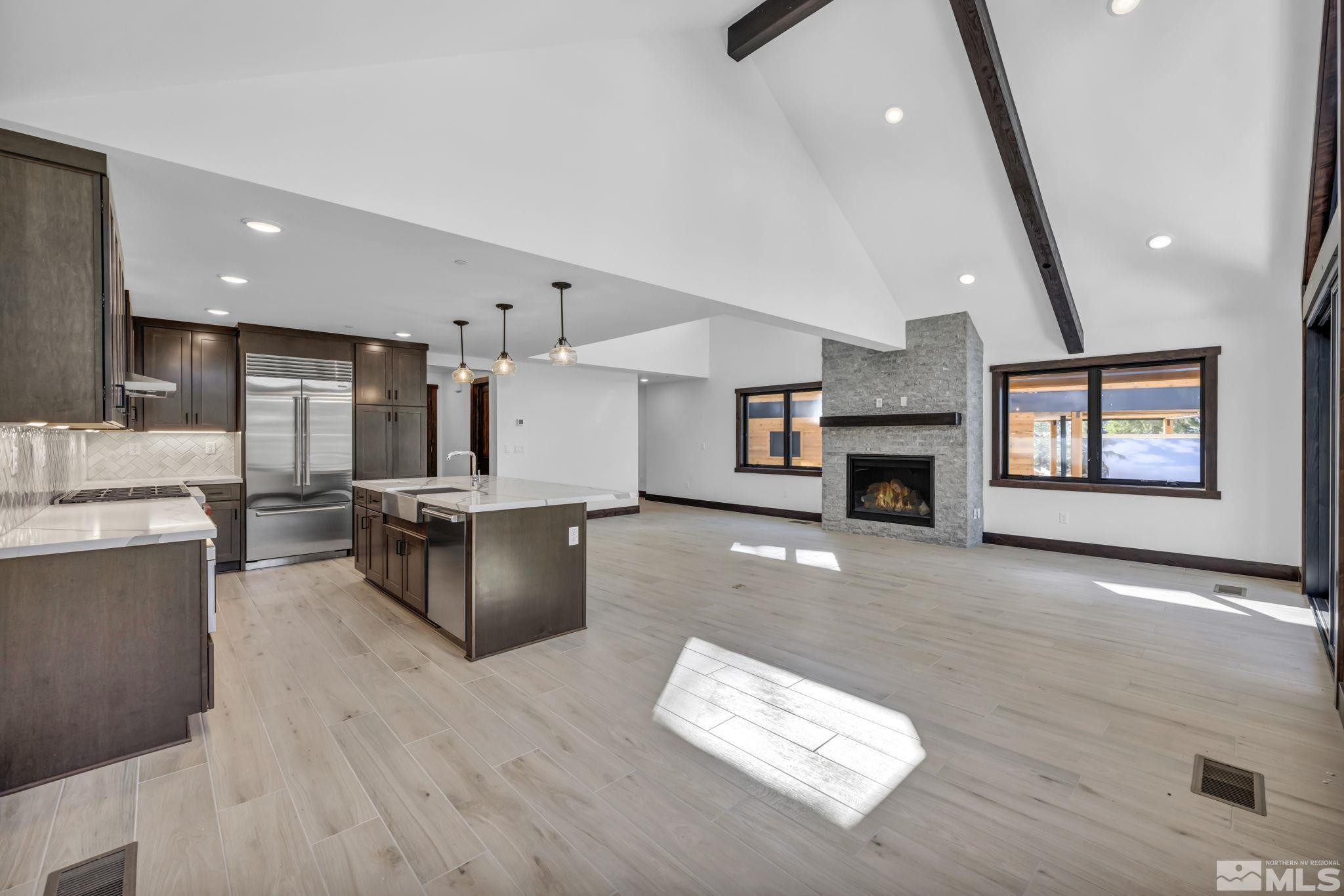 146 Sierra Colina Drive, Unit 34 Stateline, NV 89449 - Photo 10 of 38 a living room with furniture and a fireplace