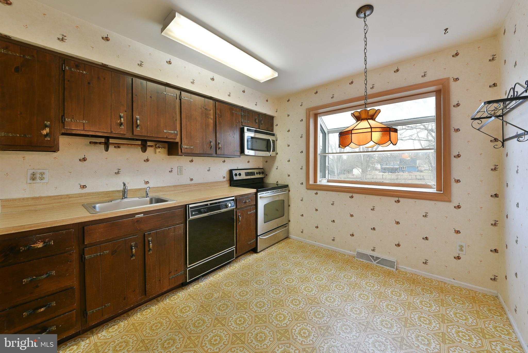 13 Glen Road Lansdale, PA 19446 - Photo 14 of 33 a kitchen with stainless steel appliances a stove sink and microwave