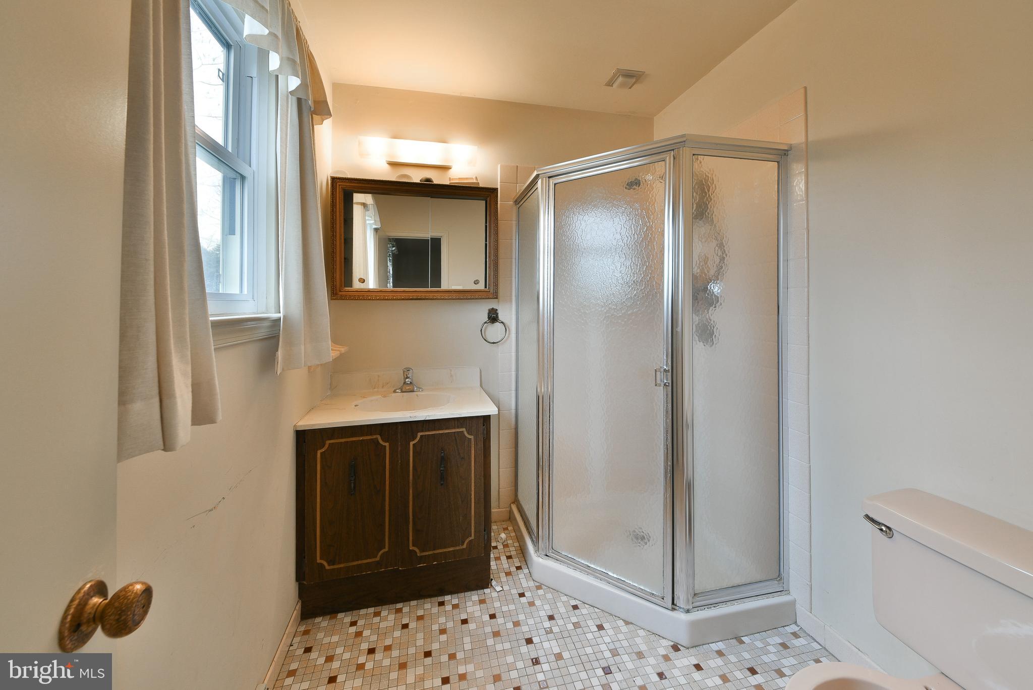13 Glen Road Lansdale, PA 19446 - Photo 18 of 33 a bathroom with a sink and mirror