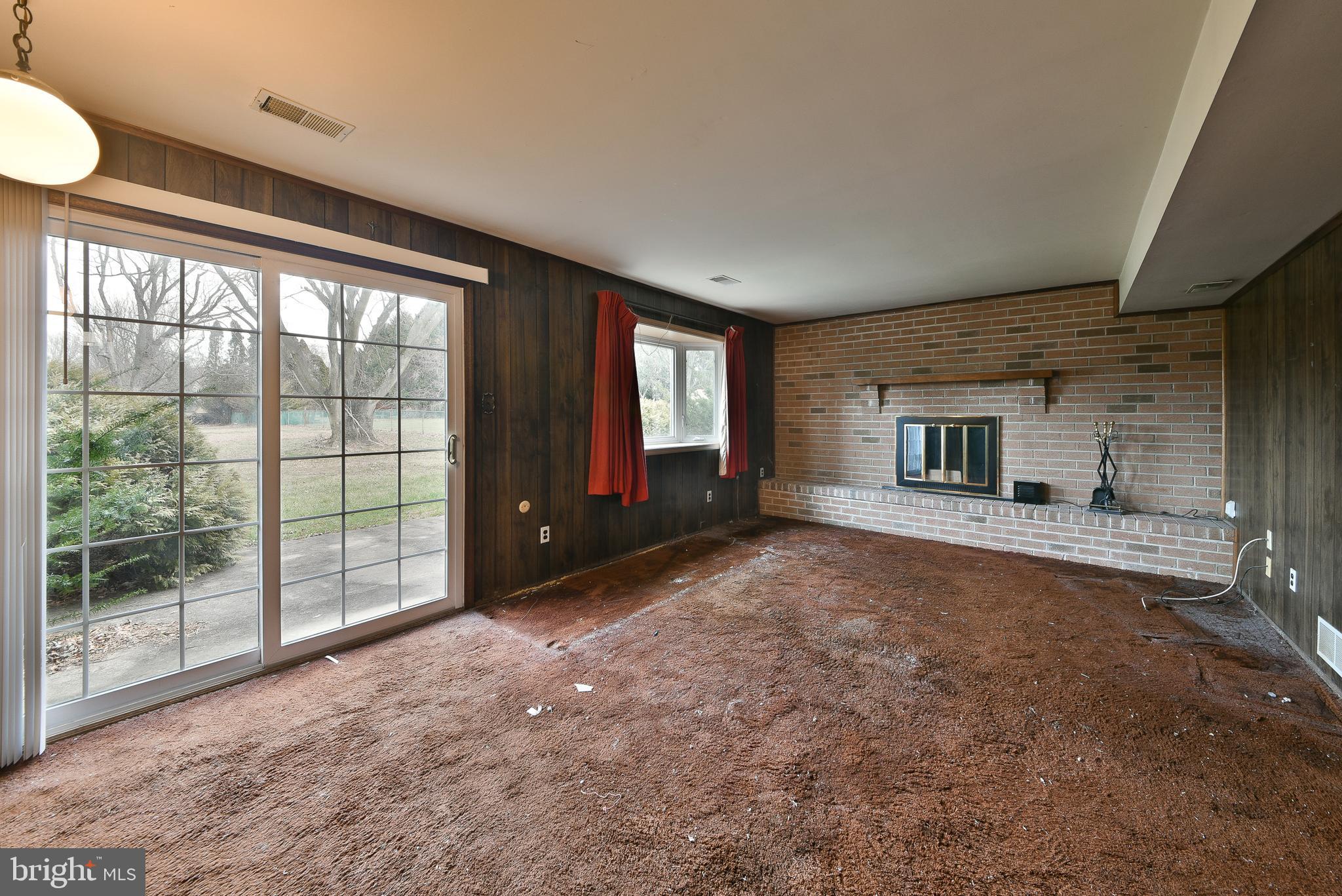 13 Glen Road Lansdale, PA 19446 - Photo 22 of 33 a view of a room with a fireplace and large windows