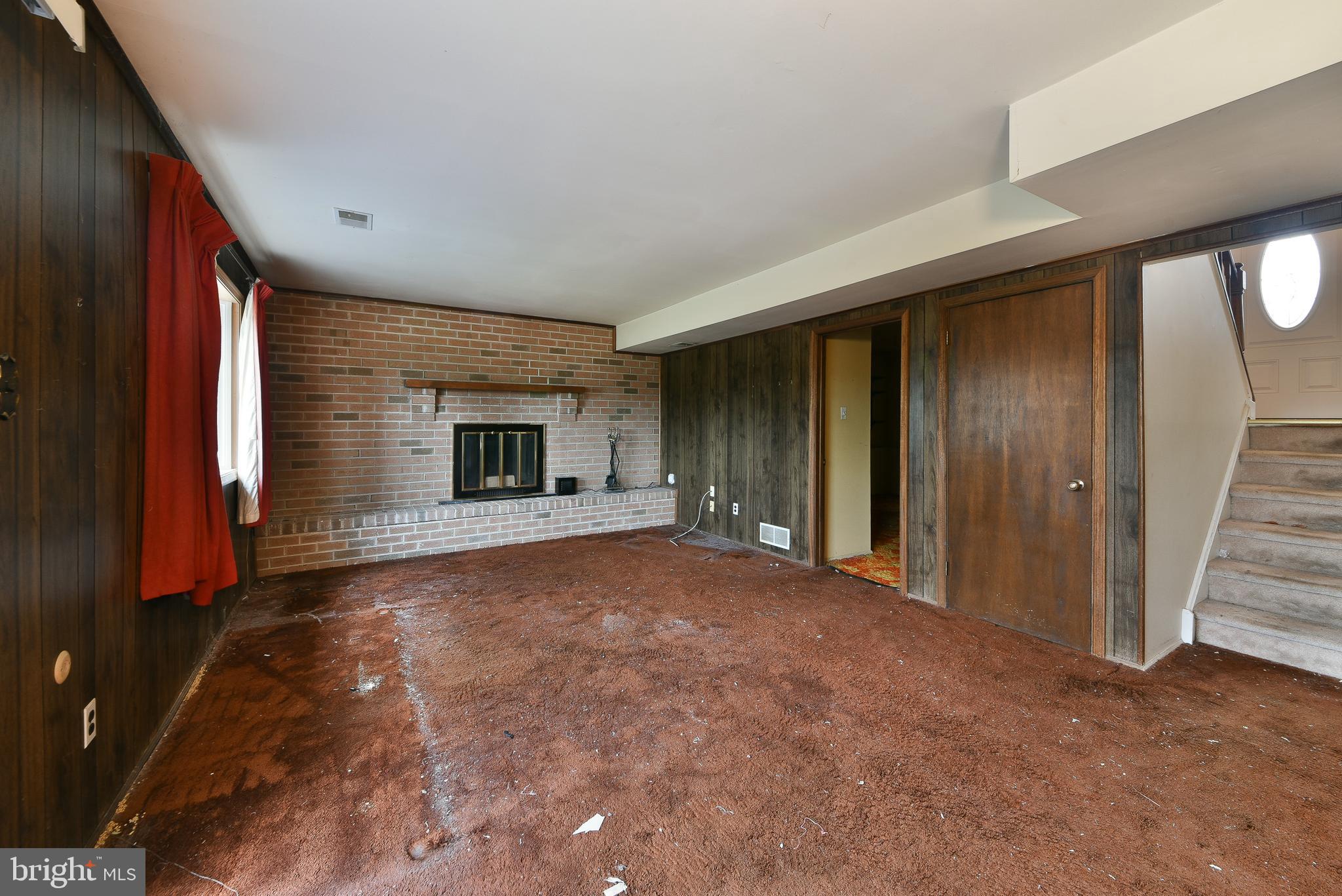 13 Glen Road Lansdale, PA 19446 - Photo 24 of 33 an empty room with fireplace and windows