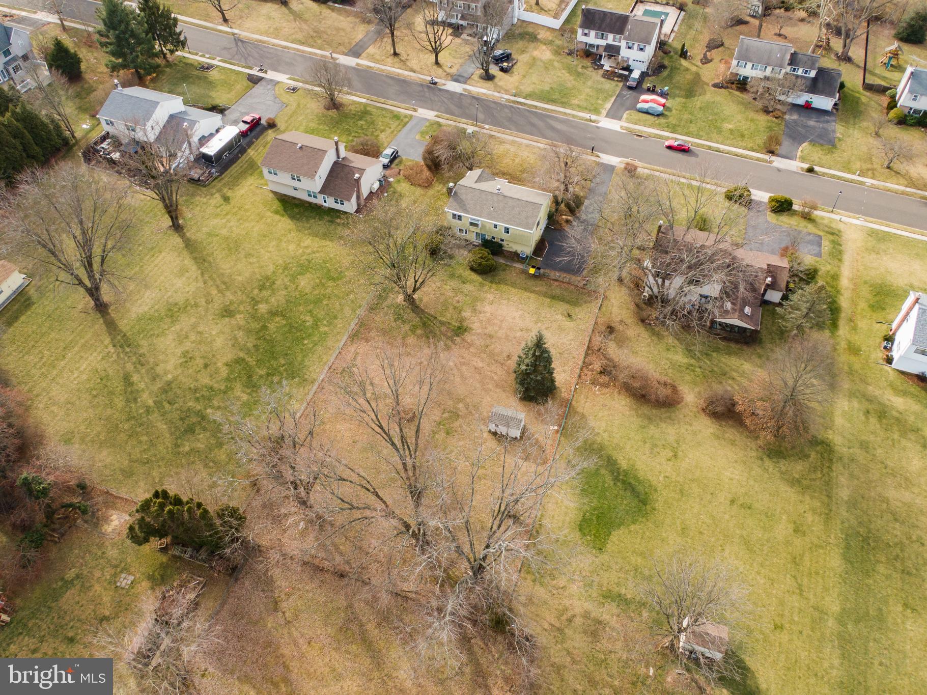 13 Glen Road Lansdale, PA 19446 - Photo 7 of 33 a bed with a white comforter and pillows