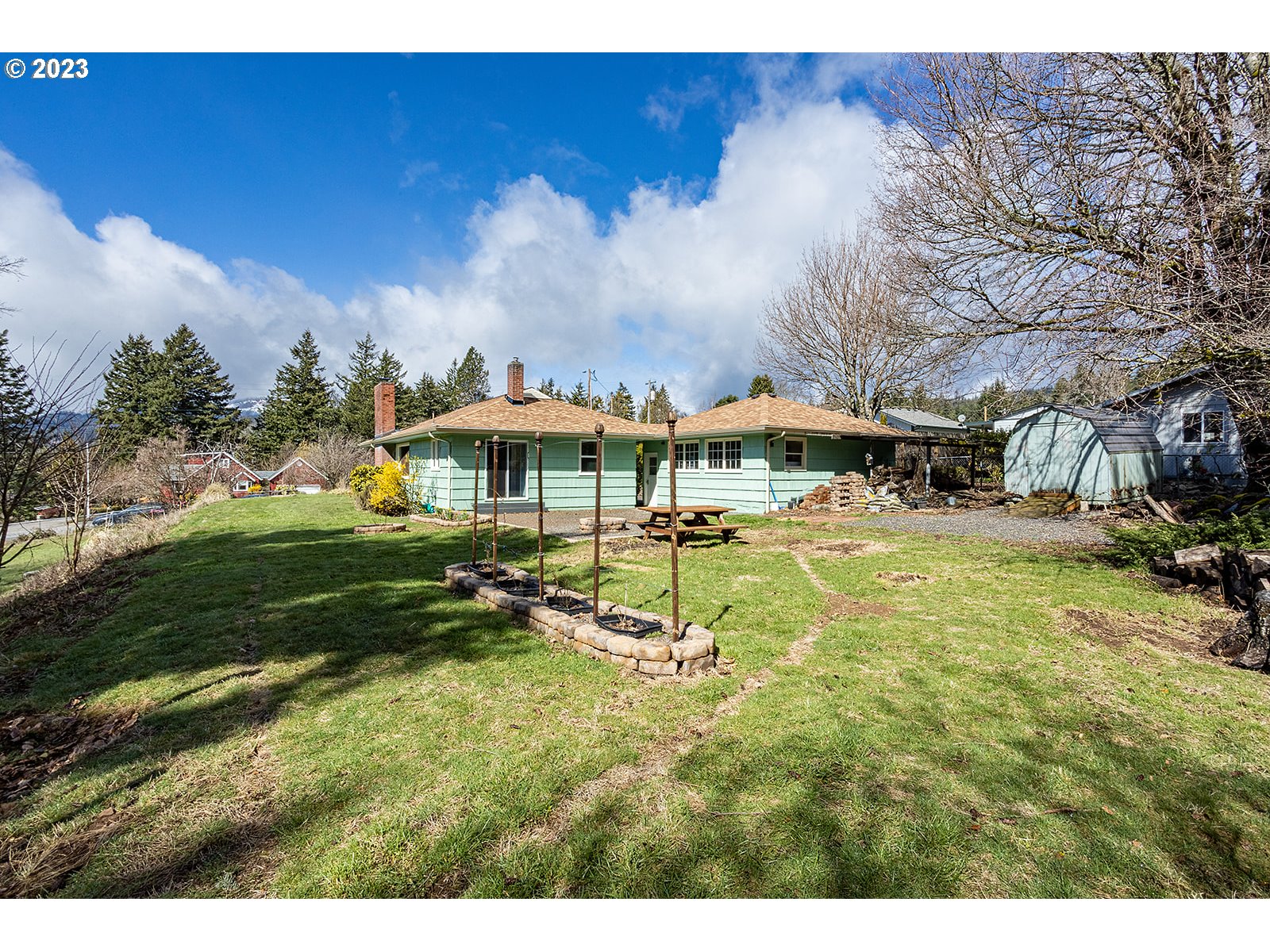 390 Northwest Chesser Road Stevenson, WA 98648 - Photo 5 of 42 a swimming pool with outdoor seating and yard