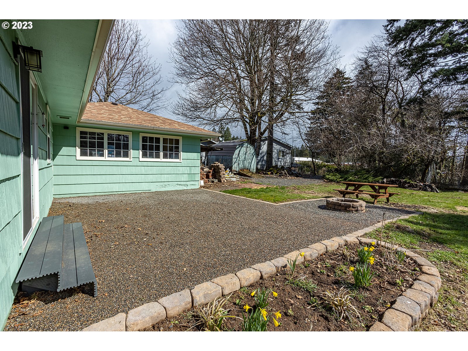 390 Northwest Chesser Road Stevenson, WA 98648 - Photo 6 of 42 a view of a house with backyard and sitting area