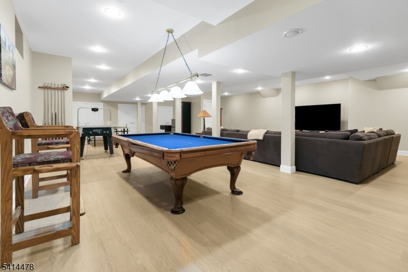 33 St Nickolas Way Bernards, NJ 07920 - Photo 34 of 50 a room with pool table flat screen tv and windows