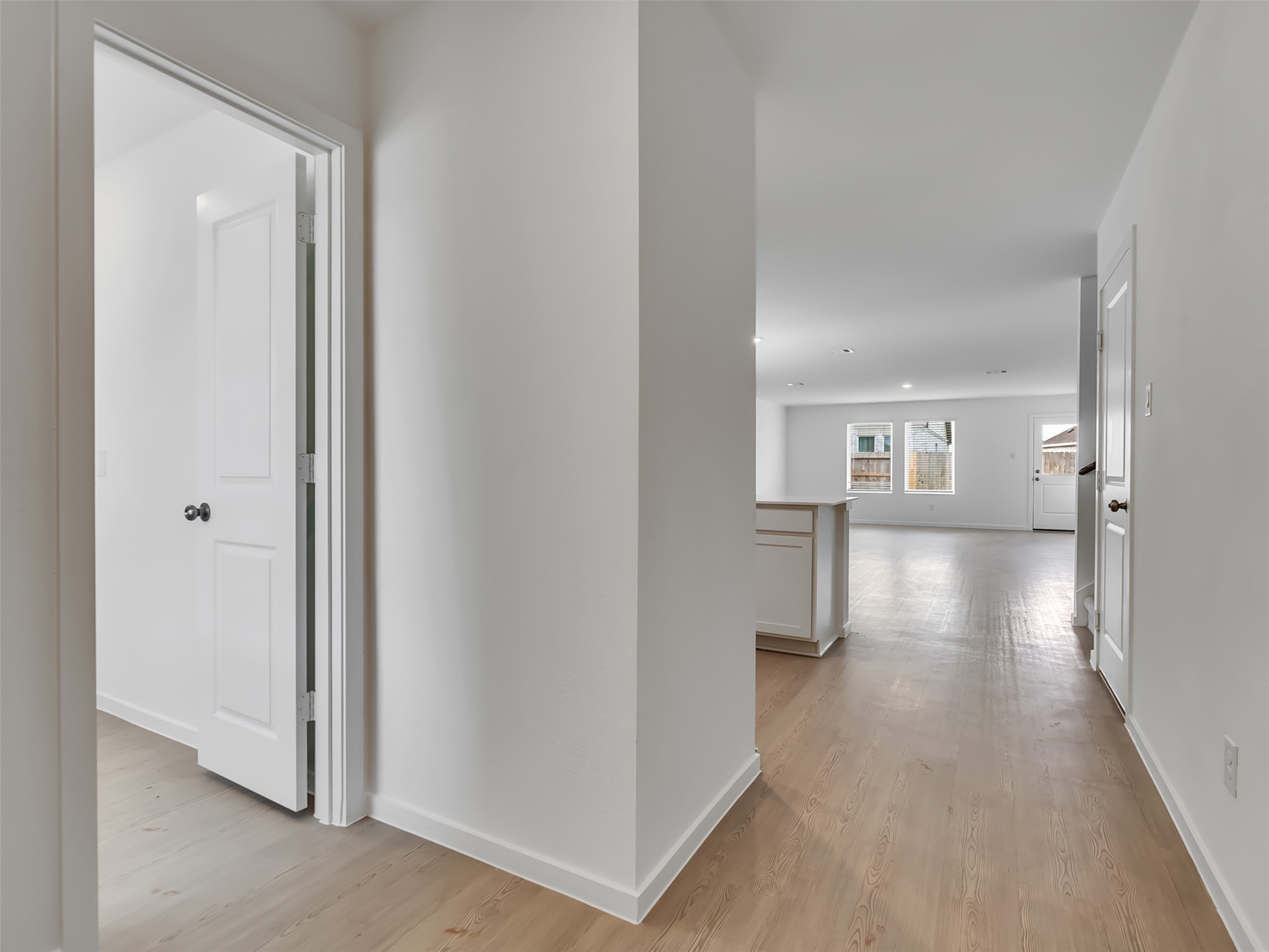 3041 Colusa Rdg Drive Katy, TX 77493 - Photo 3 of 26 a view of a hallway with wooden floor and a living room