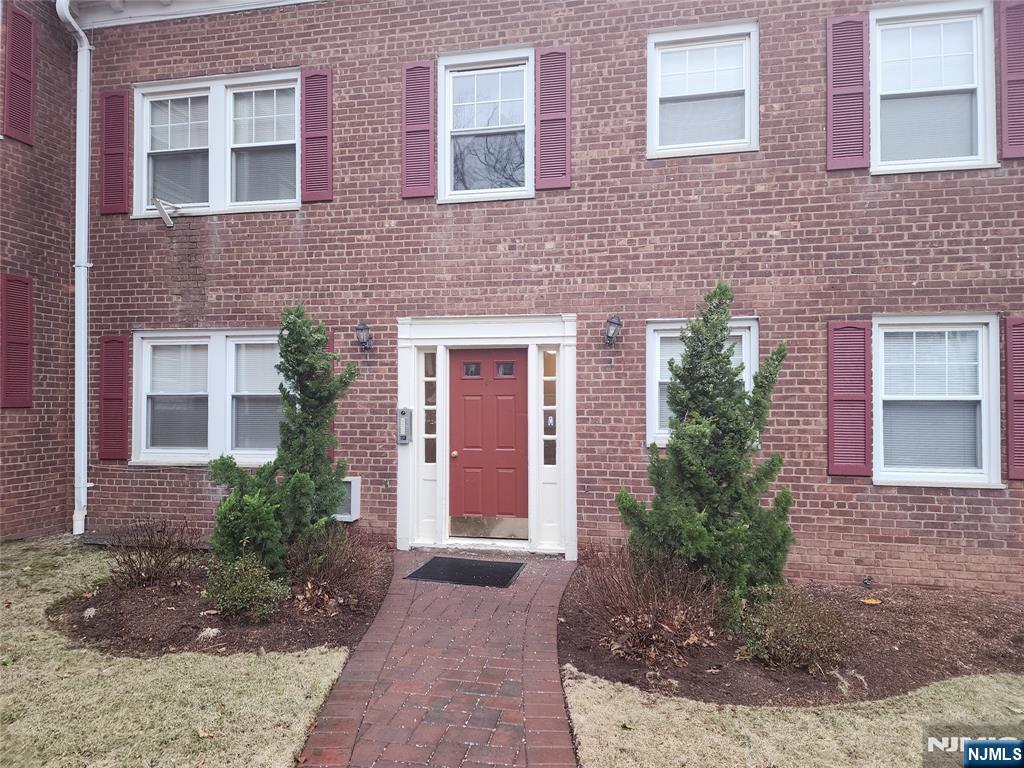 490 Beverly Road, Unit C2 Teaneck, NJ 07666 - Photo 1 of 1 a view of a brick house with outdoor space