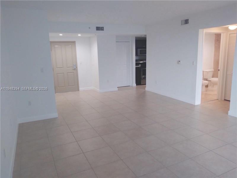 2650 Southwest 37th Avenue, Unit 604 Miami, FL 33134 - Photo 14 of 22 an empty room with a bathroom and a window