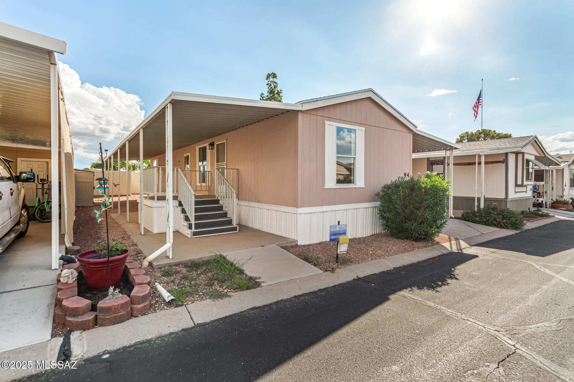 8401 South Kolb Road, Unit 94 Tucson, AZ 85756 - Photo 2 of 24 a front view of a house with a yard