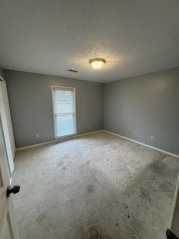 a view of a backyard of a house