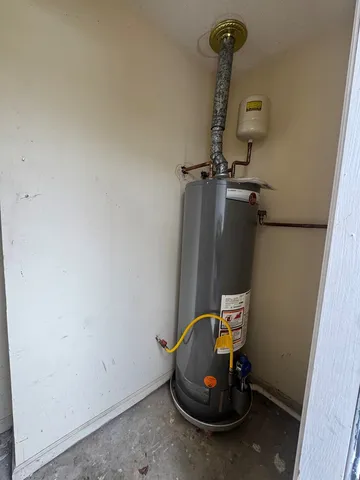 a view of room that has a bed and a chair