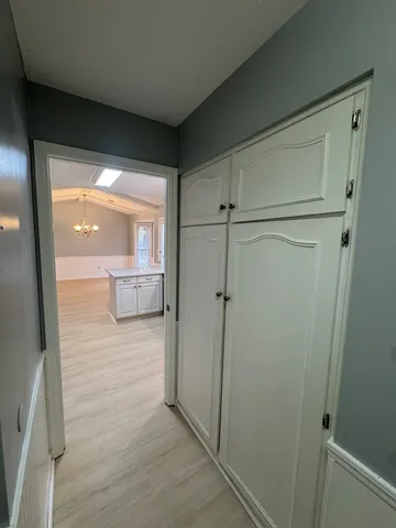 a large white bed in a white room