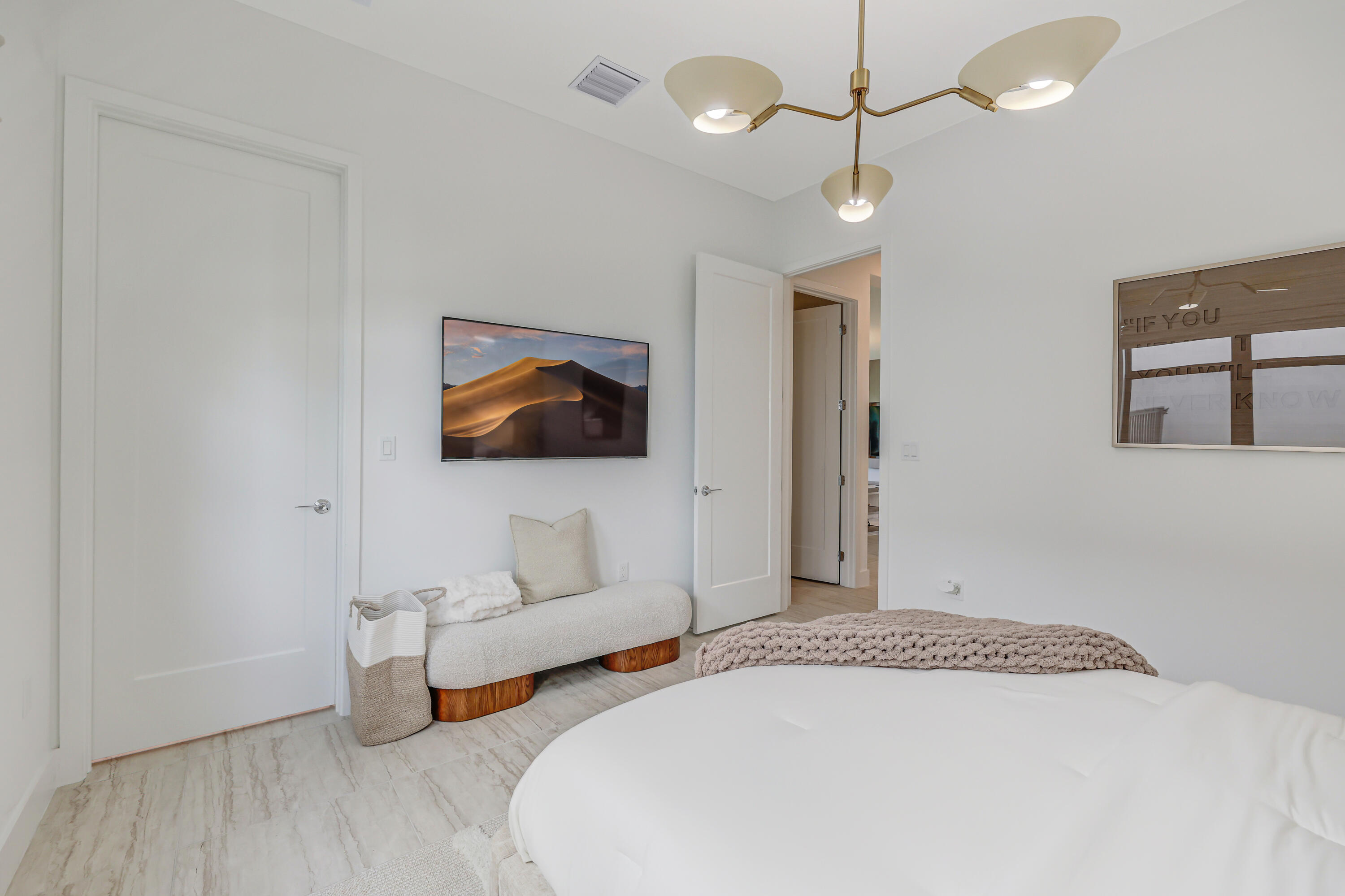 8283 Royal County Down Road Boca Raton, FL 33434 - Photo 25 of 88 a bedroom with a bed and a flat screen tv