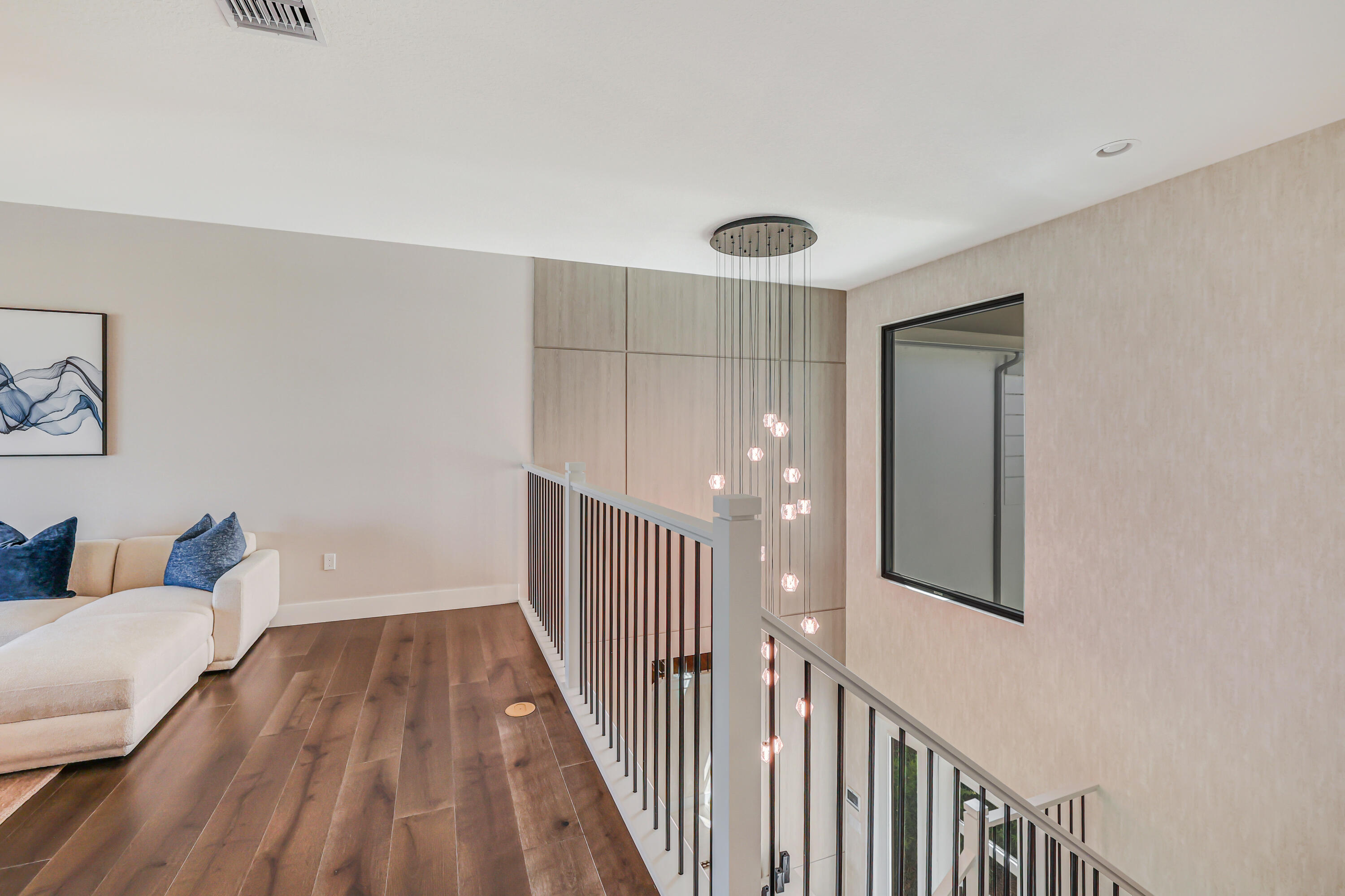 8283 Royal County Down Road Boca Raton, FL 33434 - Photo 36 of 88 a view of a hallway with wooden floor and furniture