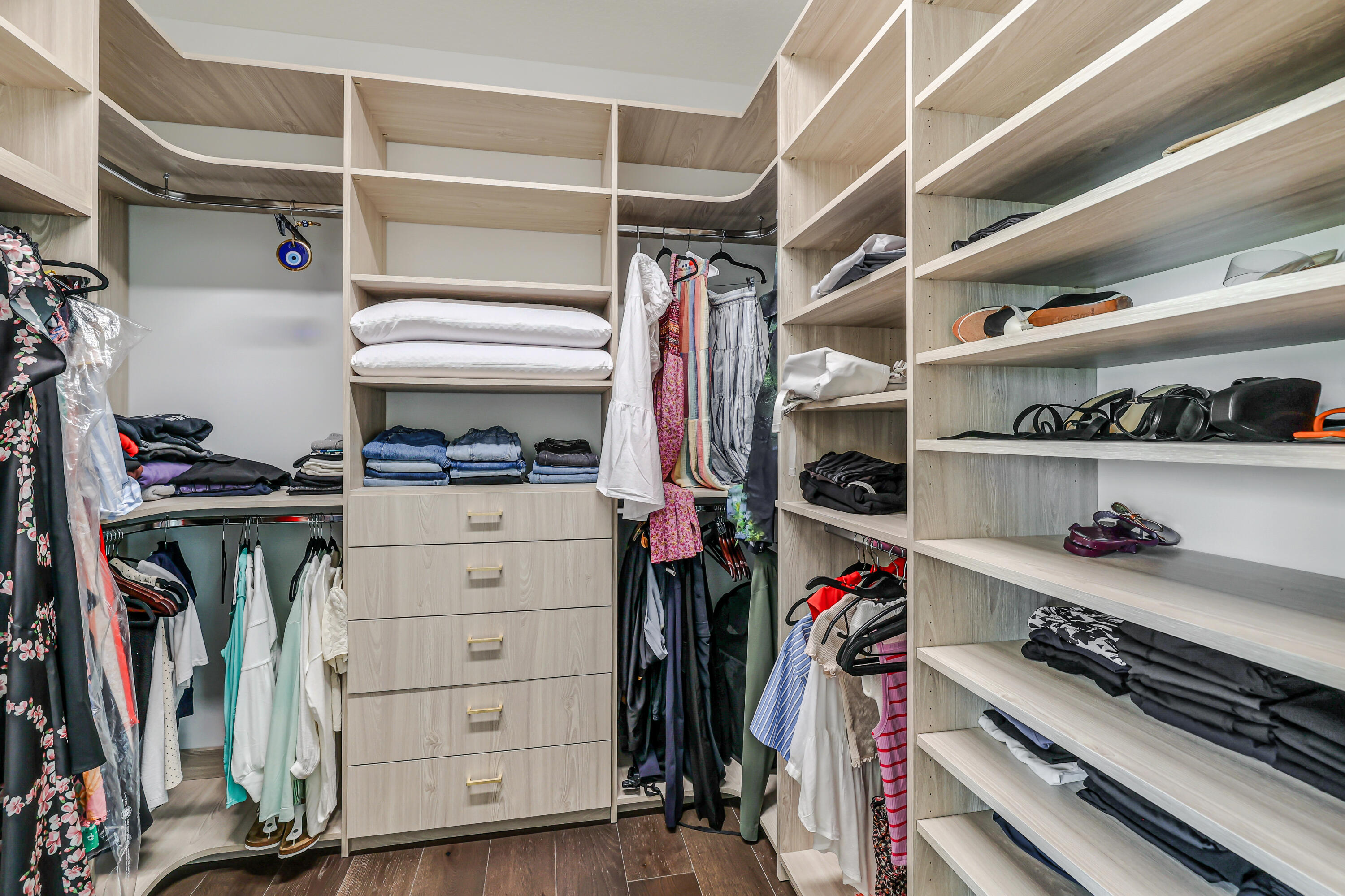 8283 Royal County Down Road Boca Raton, FL 33434 - Photo 42 of 88 a view of walk in closet with clothes and shoes