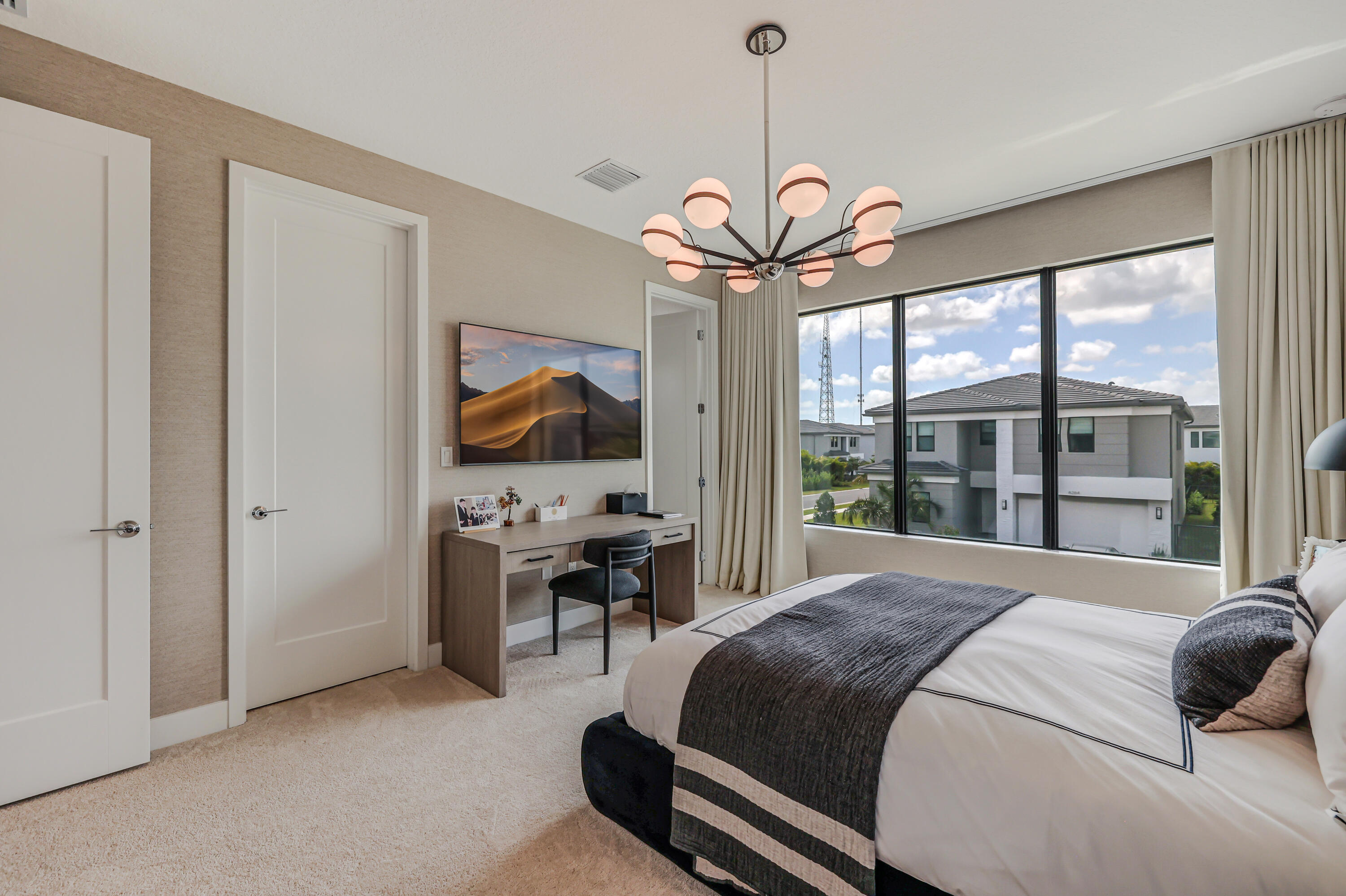 8283 Royal County Down Road Boca Raton, FL 33434 - Photo 54 of 88 a bedroom with a bed and a chandelier