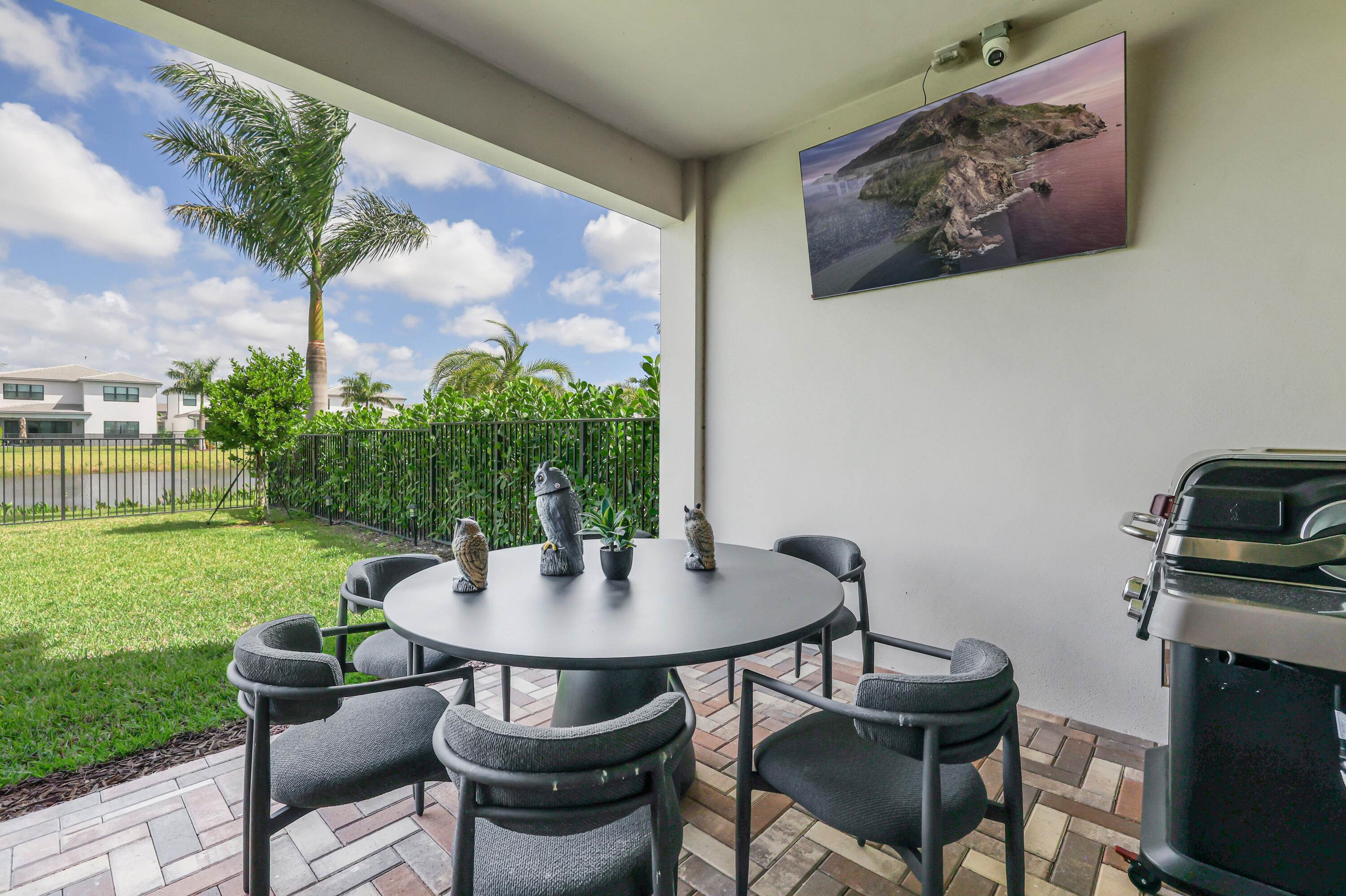8283 Royal County Down Road Boca Raton, FL 33434 - Photo 59 of 88 a view of a patio in the backyard