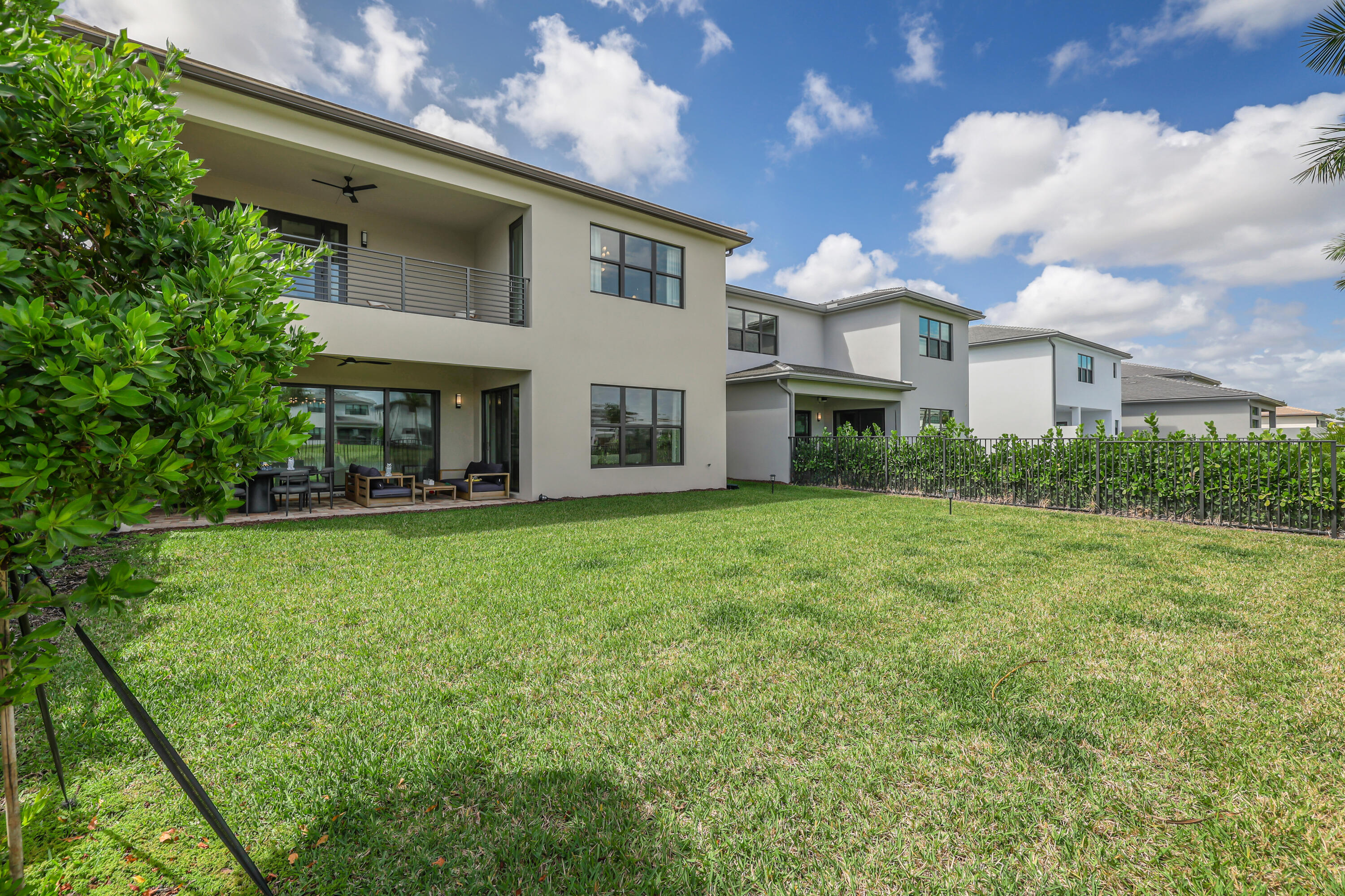 8283 Royal County Down Road Boca Raton, FL 33434 - Photo 66 of 88 a front view of house with yard and trees