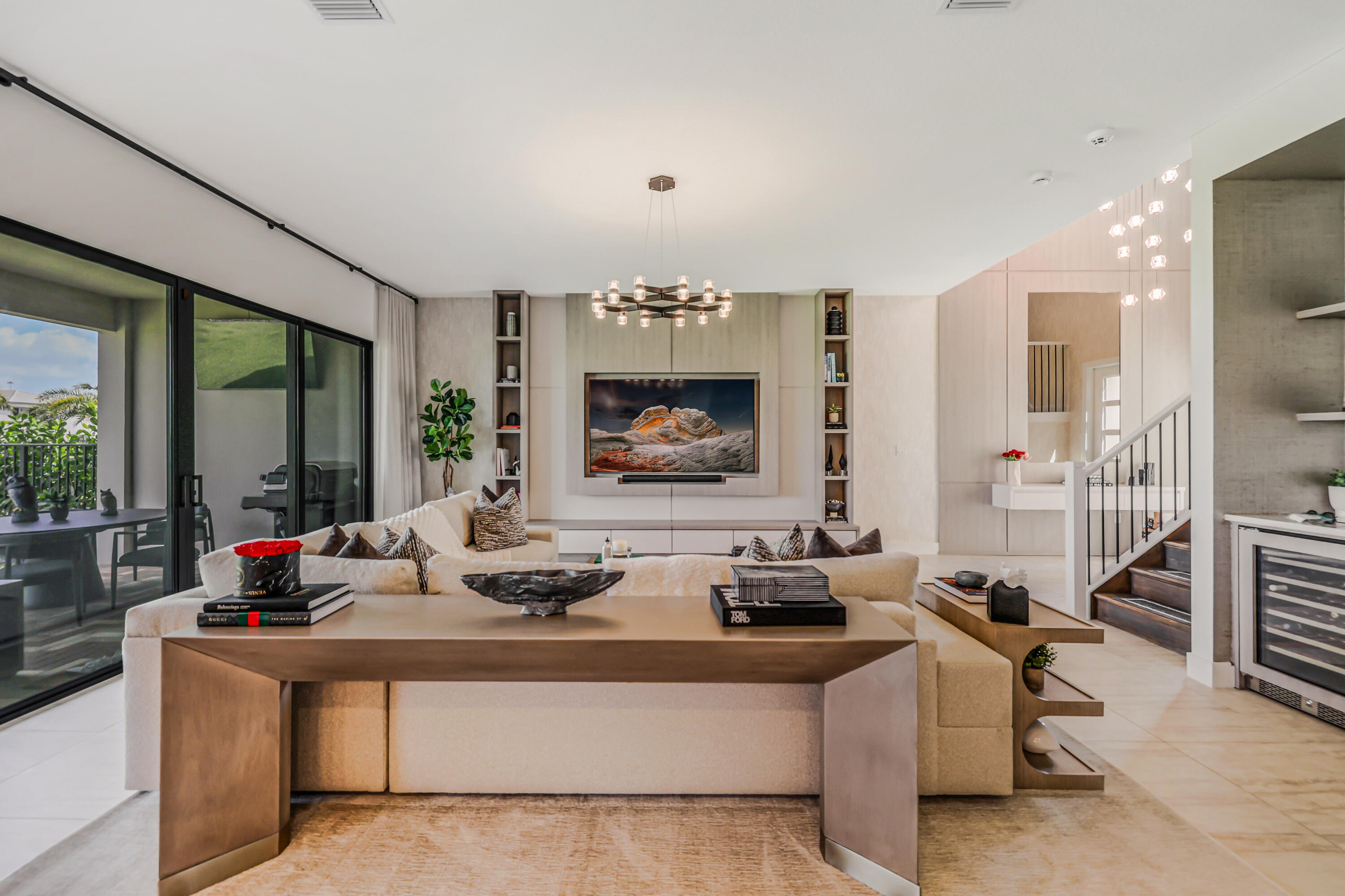 8283 Royal County Down Road Boca Raton, FL 33434 - Photo 10 of 88 a living room with furniture a chandelier and a large window