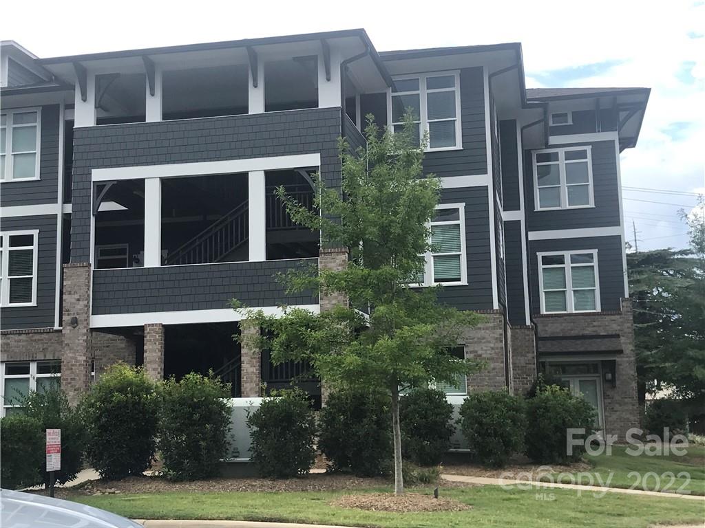 935 McAlway Road, Unit 306 Charlotte, NC 28211 - Photo 1 of 35 a front view of a building with yard and green space
