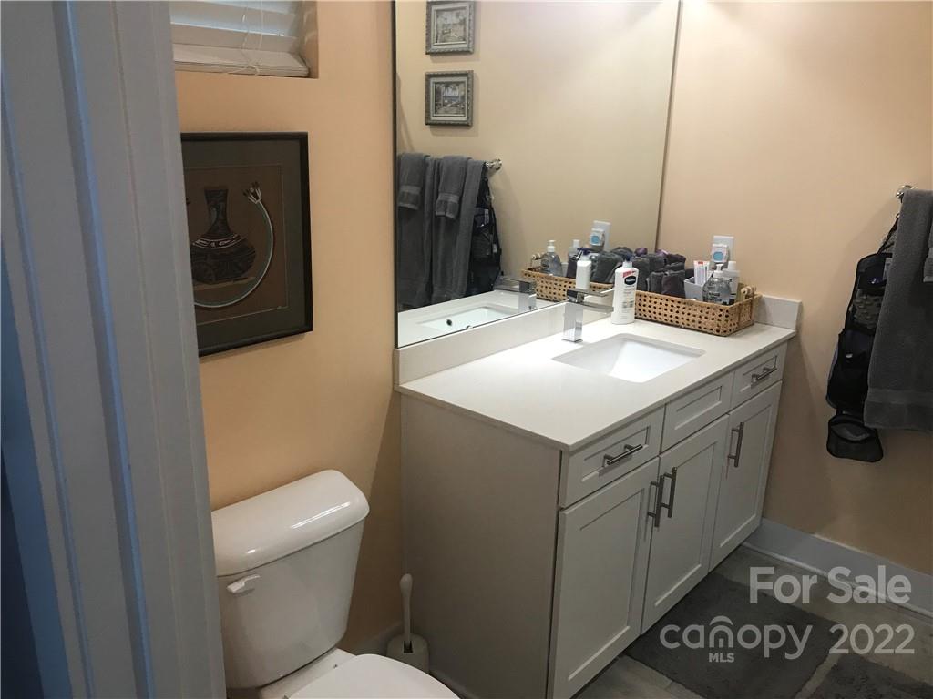 935 McAlway Road, Unit 306 Charlotte, NC 28211 - Photo 11 of 35 a bathroom with a sink and a mirror