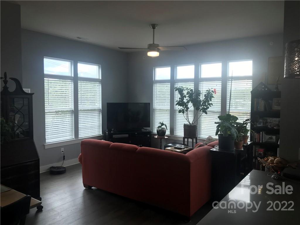 935 McAlway Road, Unit 306 Charlotte, NC 28211 - Photo 18 of 35 a living room with furniture and a flat screen tv