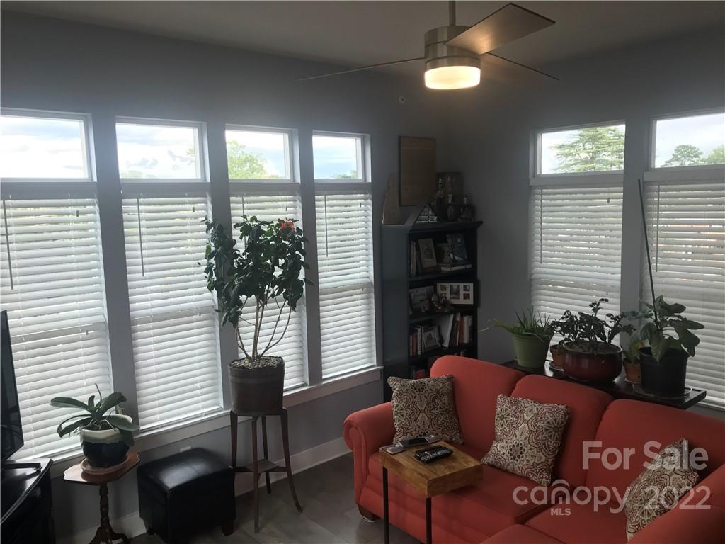 935 McAlway Road, Unit 306 Charlotte, NC 28211 - Photo 21 of 35 a living room with furniture and a potted plant