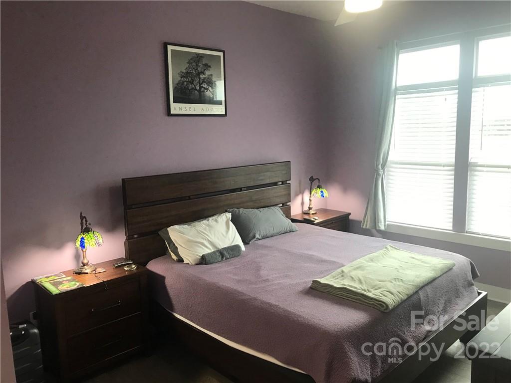 935 McAlway Road, Unit 306 Charlotte, NC 28211 - Photo 25 of 35 a bedroom with a bed and a window