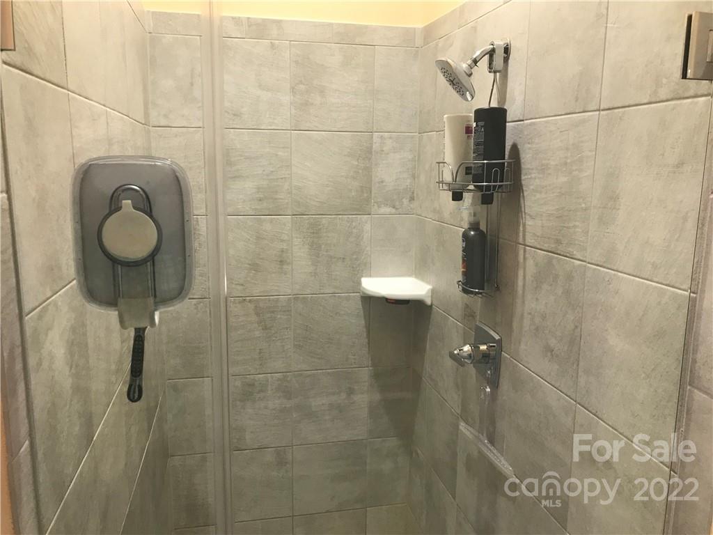 935 McAlway Road, Unit 306 Charlotte, NC 28211 - Photo 28 of 35 a bathroom with a shower