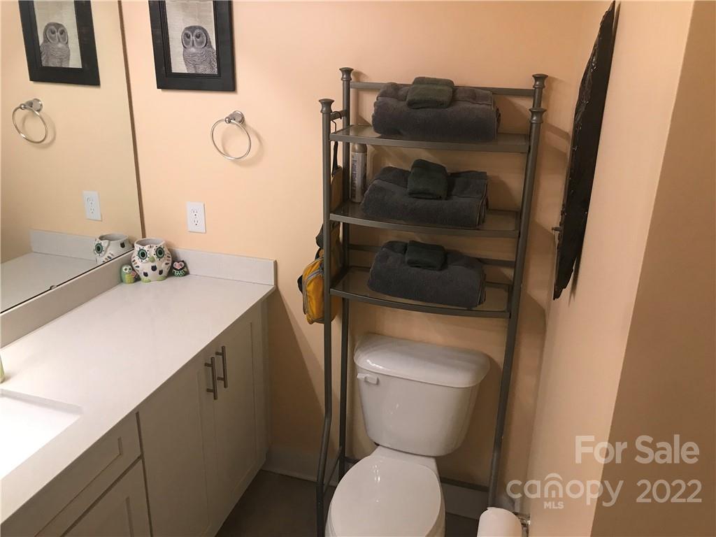 935 McAlway Road, Unit 306 Charlotte, NC 28211 - Photo 29 of 35 a bathroom with a toilet and a sink