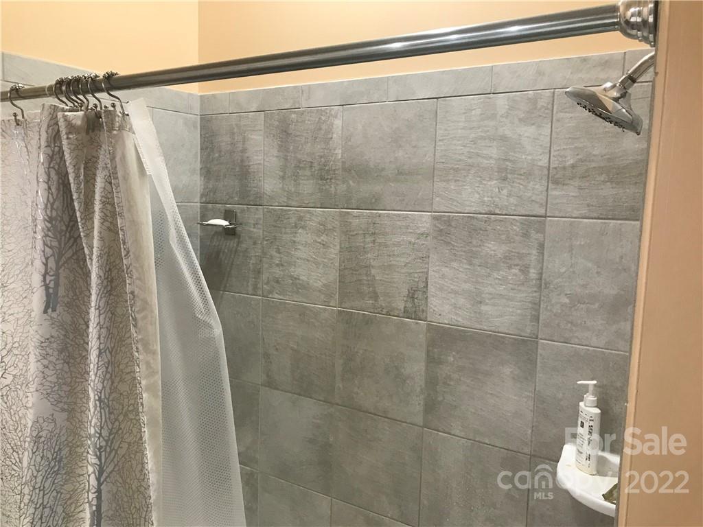 935 McAlway Road, Unit 306 Charlotte, NC 28211 - Photo 10 of 35 a bathroom with a shower