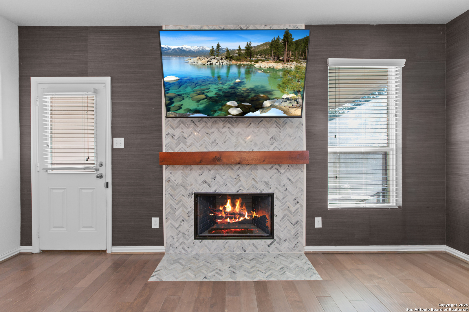 7616 Mission Summit Boerne, TX 78015 - Photo 11 of 22 a view of an empty room with wooden floor and a window