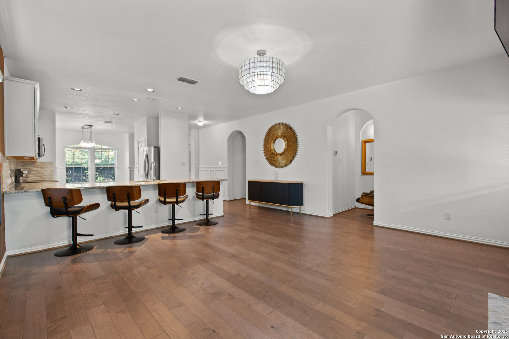7616 Mission Summit Boerne, TX 78015 - Photo 13 of 22 a living room with furniture and a wooden floor