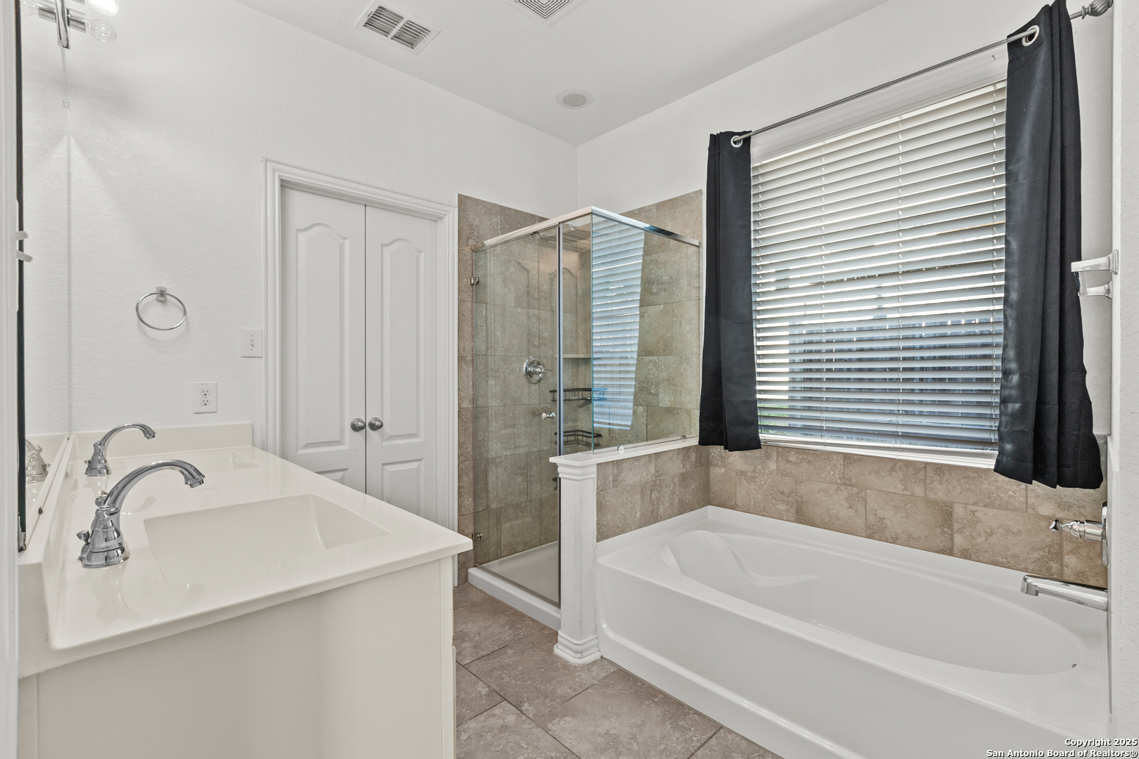 7616 Mission Summit Boerne, TX 78015 - Photo 15 of 22 a bathroom with a bathtub and a sink