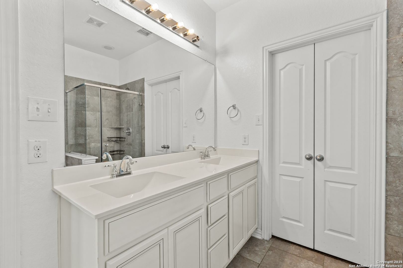 7616 Mission Summit Boerne, TX 78015 - Photo 16 of 22 a bathroom with a sink and a mirror