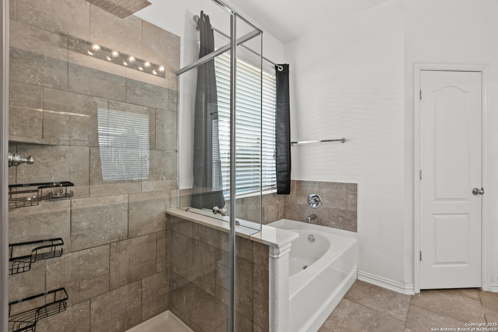 7616 Mission Summit Boerne, TX 78015 - Photo 17 of 22 a bathroom with a tub sink and window