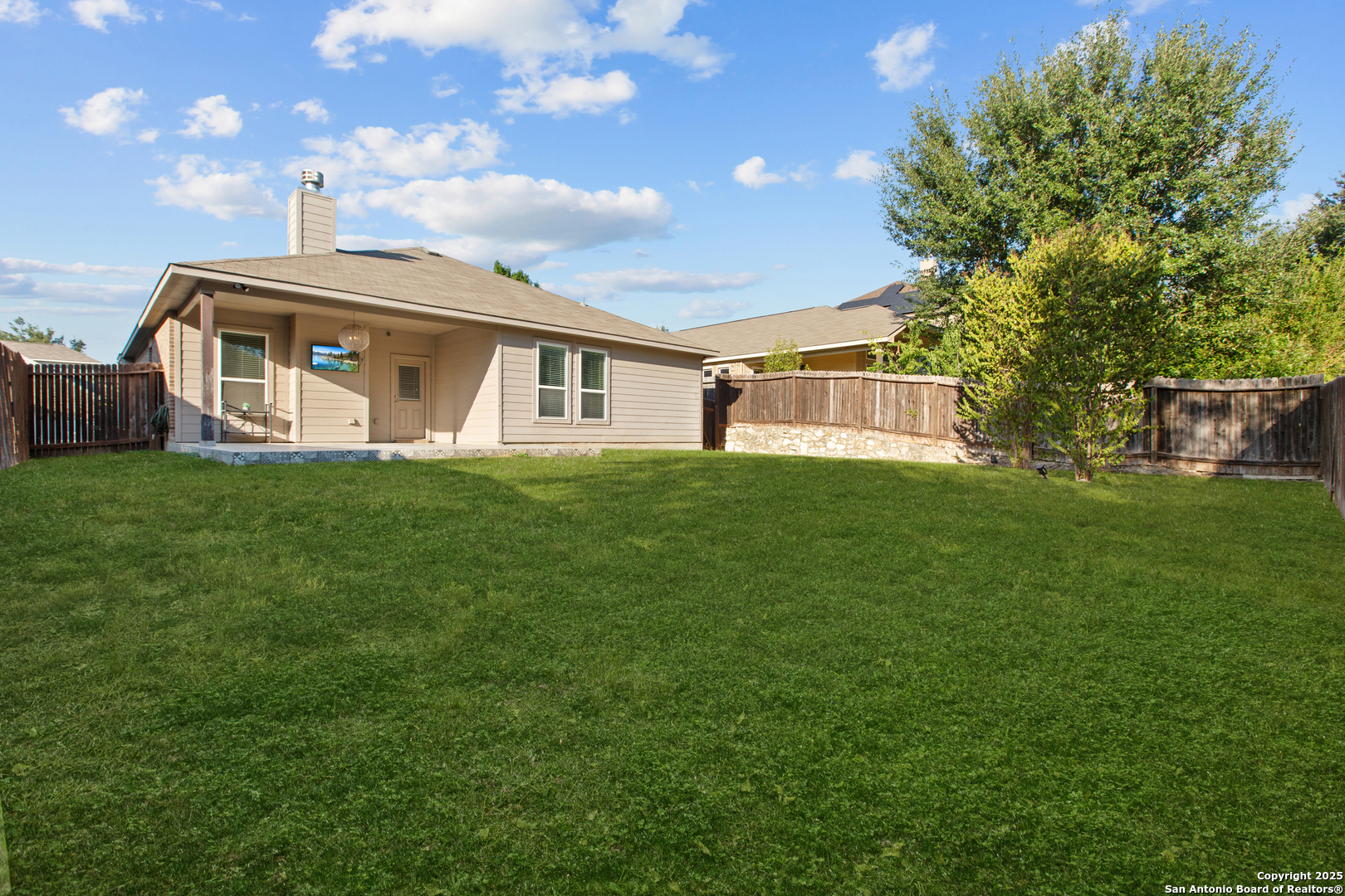 7616 Mission Summit Boerne, TX 78015 - Photo 20 of 22 a front view of a house with a garden