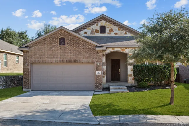 front view of a house with a yard
