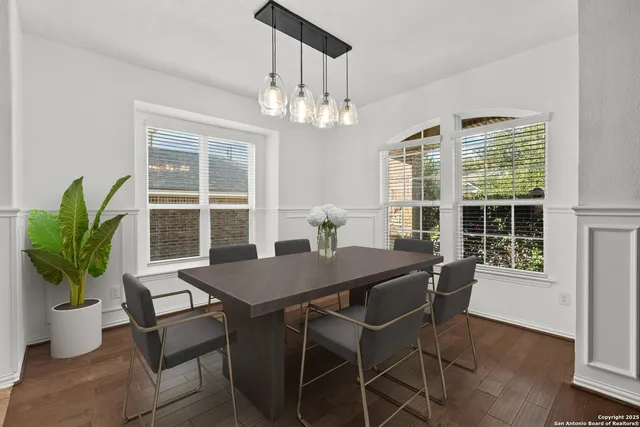 a view of a dining room with furniture window and wooden floor
