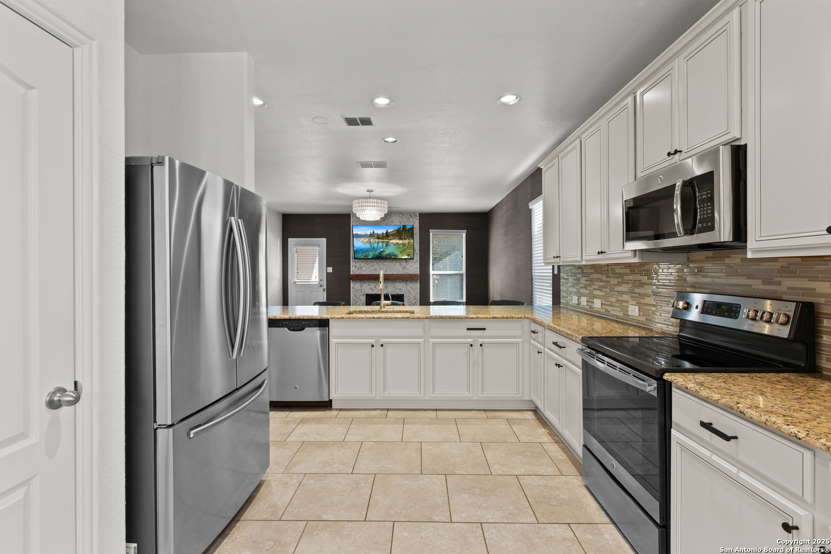 7616 Mission Summit Boerne, TX 78015 - Photo 7 of 22 a kitchen with a refrigerator sink and microwave