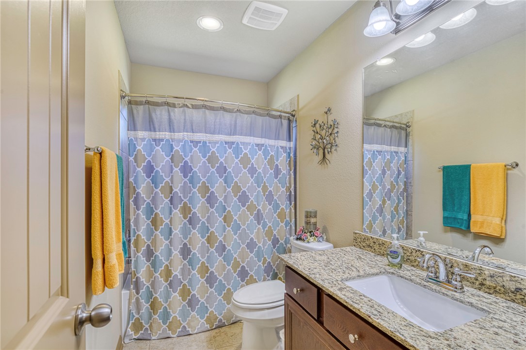 9945 Oxford Cemetery Road Madisonville, TX 77864 - Photo 24 of 42 Bathroom with vanity, a shower with curtain, light tile patterned floors, and recessed lighting